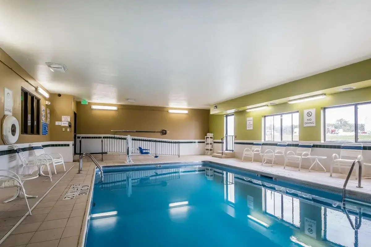 a large pool with chairs at Quality Inn Coralville - Iowa River Landing in Coralville