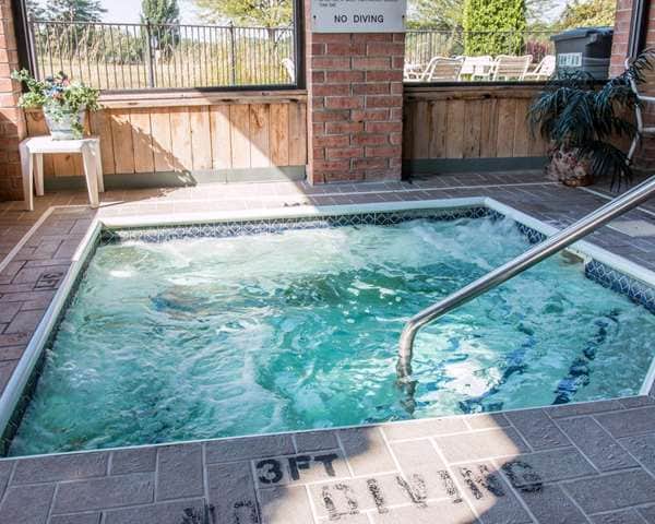 Shared outdoor hot tub at Quality Inn Hudsonville