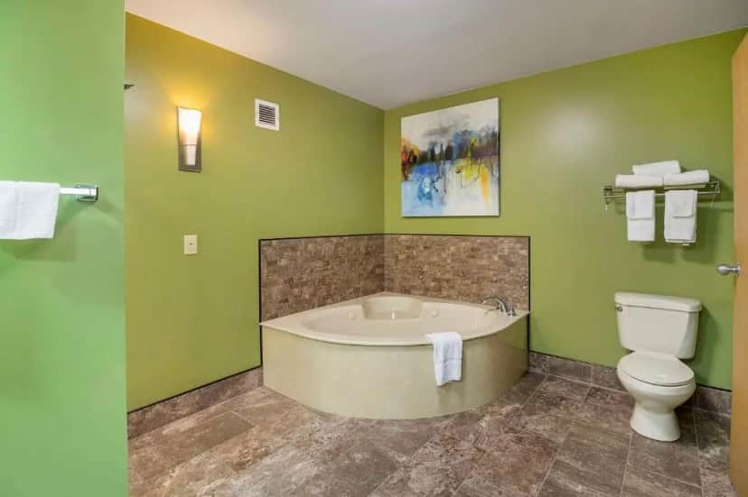 Private in-room jacuzzi tub in the Superior King Room with Whirlpool - Non-Smoking at Quality Inn