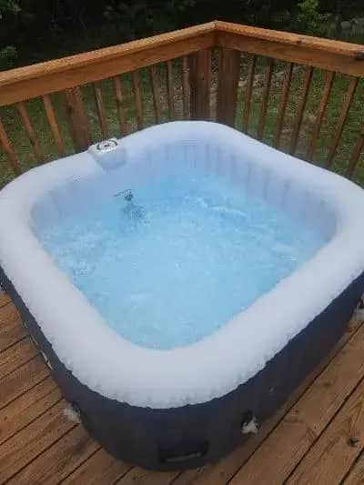 a hot tub sitting on a wooden deck at Quiet Oasis NearTown & Hospital in Simpsonville