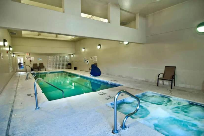 a large indoor swimming pool with a hot tub at Radisson Hotel El Paso Airport in El Paso