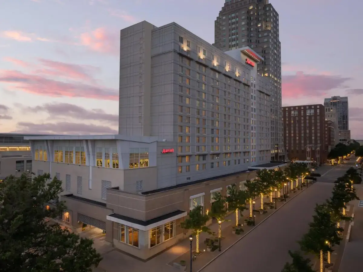a large white building with a street in front of it at Raleigh Marriott City Center in Raleigh
