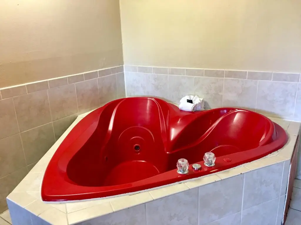 Private in-room jacuzzi tub in the King Room with Spa Bath at Red Carpet Inn Stamford