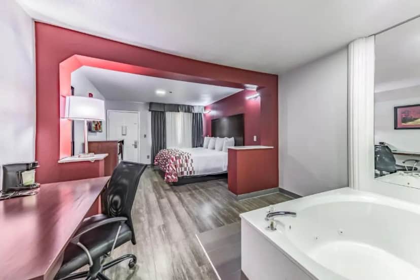 Private in-room jacuzzi in the Superior King Room with Spa Tub Smoke Free at Red Roof Inn Dallas – Mesquite Fair Park NE