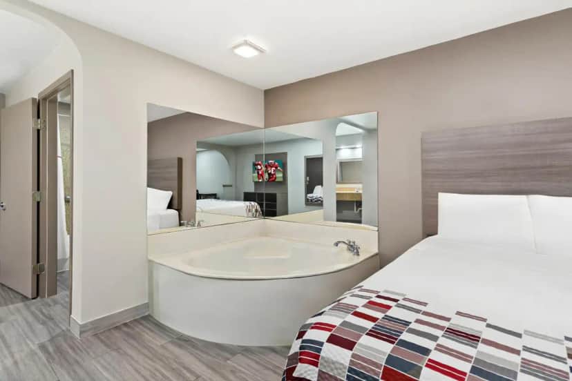 Private in-room jacuzzi tub in the Superior King Room with Jetted Tub Non-Smoking at Red Roof Inn Stafford, Tx