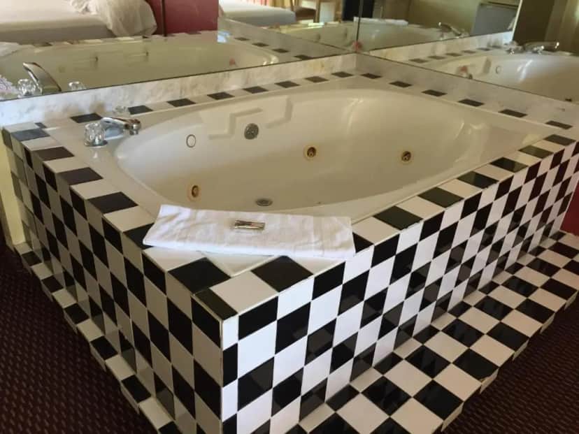 Private in-room jacuzzi tub in the King Room with Whirlpool at Relax Inn