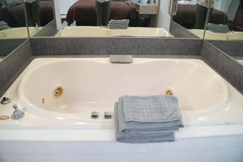 In-room hot tub at Relax Inn in Henrietta, NY