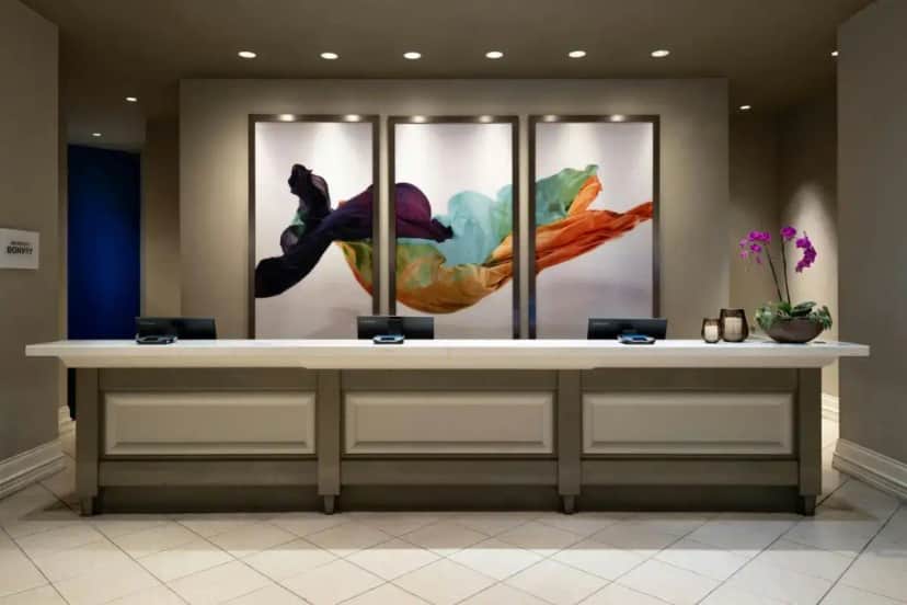 a counter in a lobby with paintings on the wall at Renaissance Tampa International Plaza Hotel in Tampa