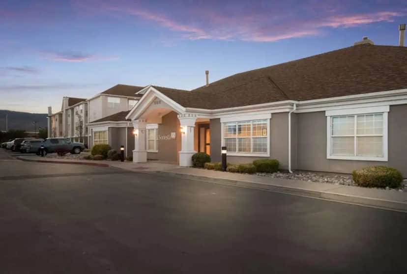 a house on a street with cars parked in front at Sonesta ES Suites Reno in Reno
