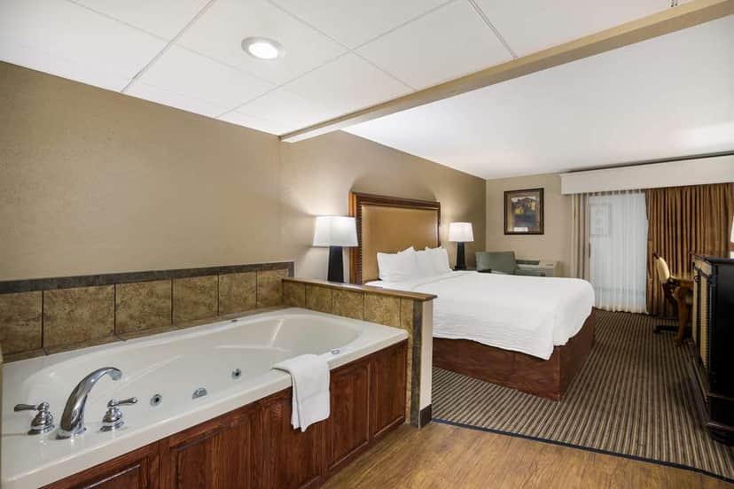 Private in-room jacuzzi at Revel Minot, SureStay Collection By Best Western
