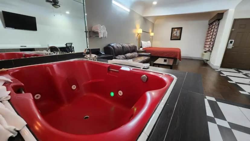 Private in-room jacuzzi in the Deluxe Suite with Spa Bath at Scottish Inn & Suites Sam Houston Parkway