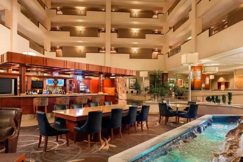 a hotel with a swimming pool and a bar at Sheraton Sioux Falls Hotel & Convention Center in Sioux Falls