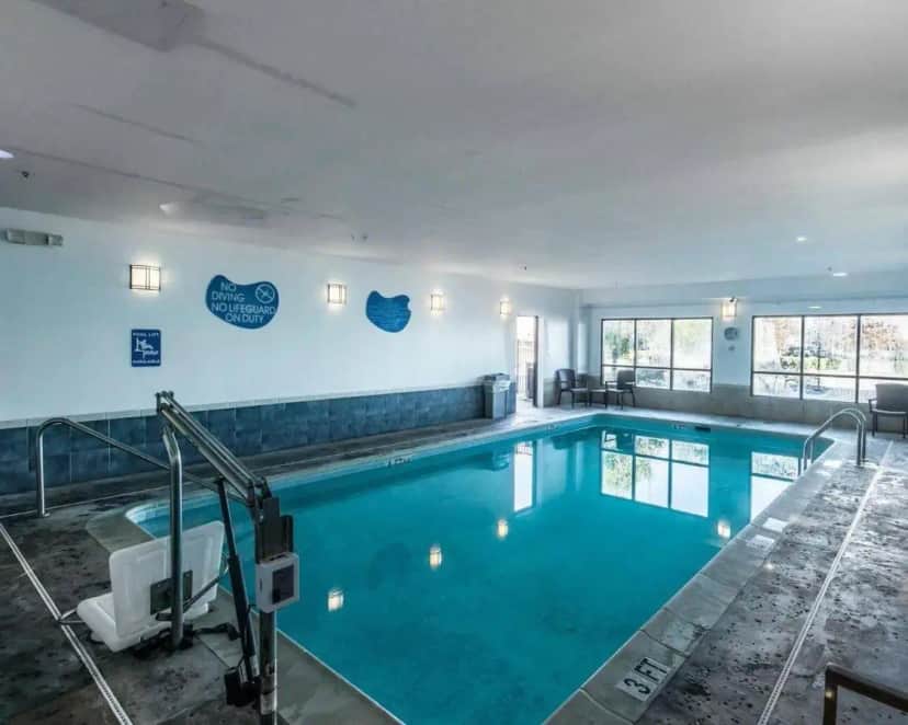 a large swimming pool in a hotel room at Sleep Inn & Suites Winchester near University in Winchester