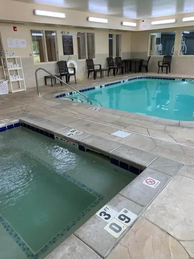 a large swimming pool in a hotel room at Sleep Inn & Suites Davenport - Quad Cities in Bettendorf