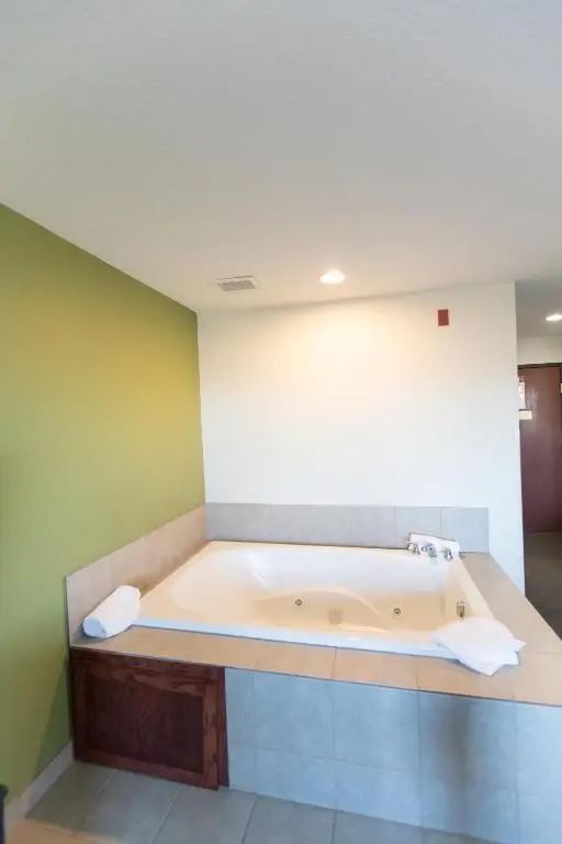 Private in-room jacuzzi tub in the King Suite with Hot Tub - Non-Smoking at Sleep Inn & Suites
