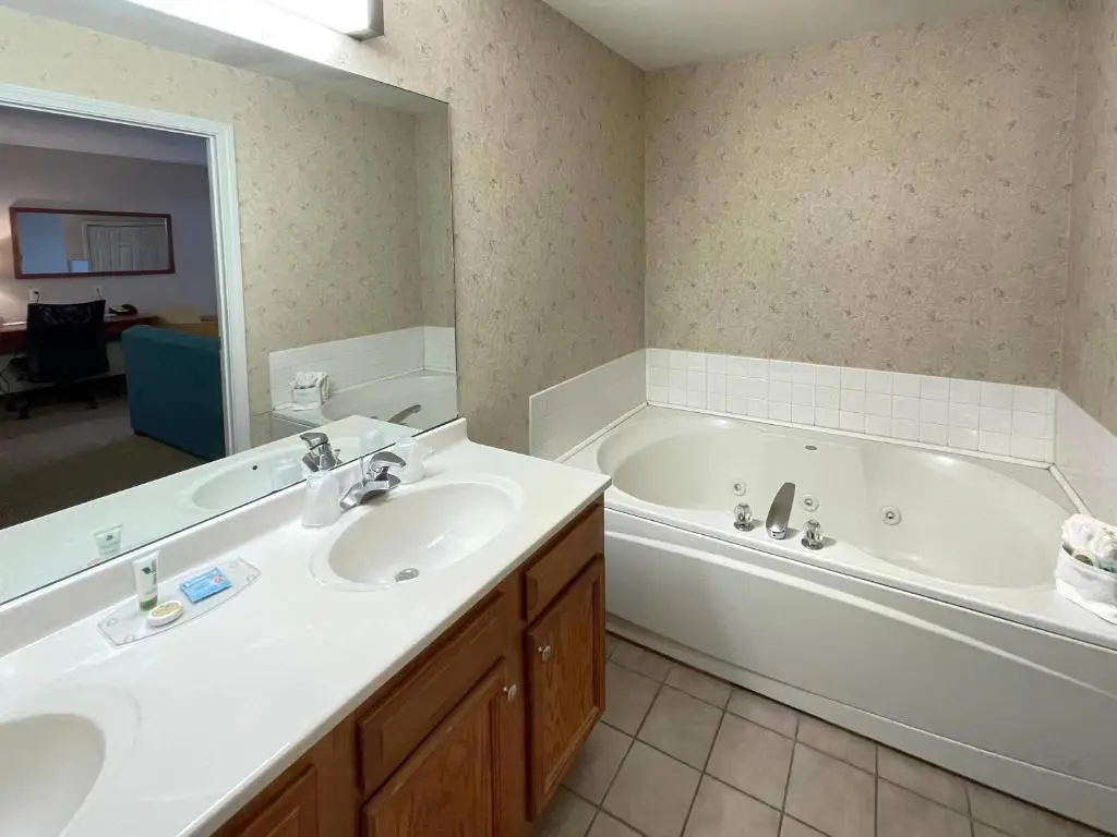 Private in-room jacuzzi tub in the Deluxe Jacuzzi Suite at Smart Suites, Ascend Hotel Collection