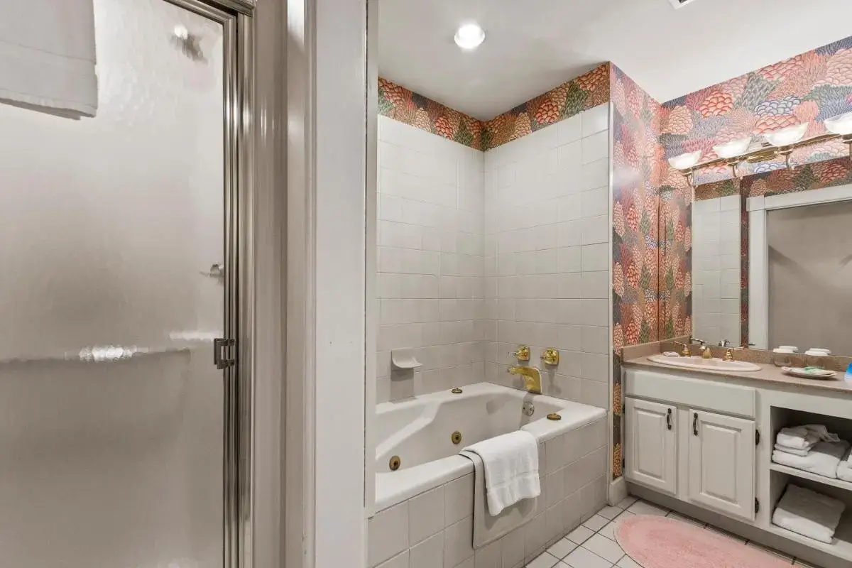 a bathroom with a tub and a sink at South Shire in Bennington