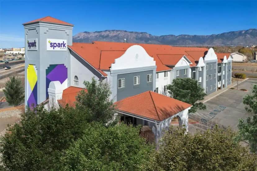 arial view of a row of buildings in a town at Spark By Hilton Albuquerque North I-25 in Albuquerque