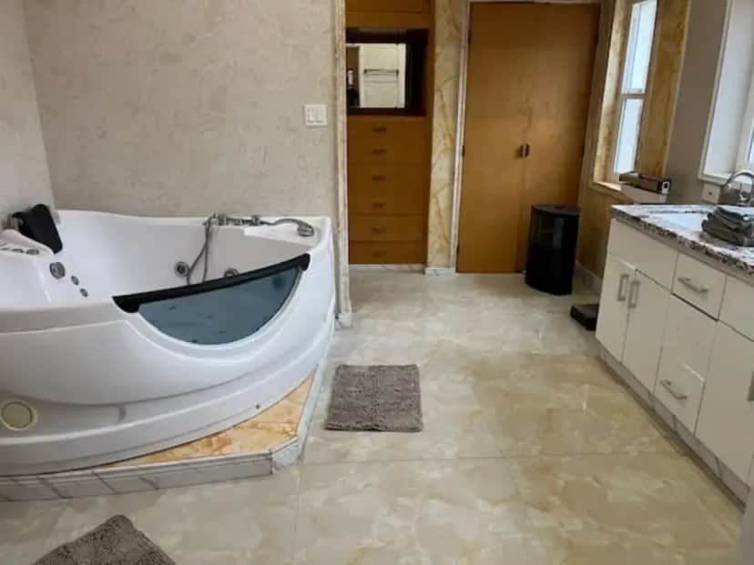 a large bathroom with a tub in the middle at Specious 6000 sf privat gated villa with View in Fremont