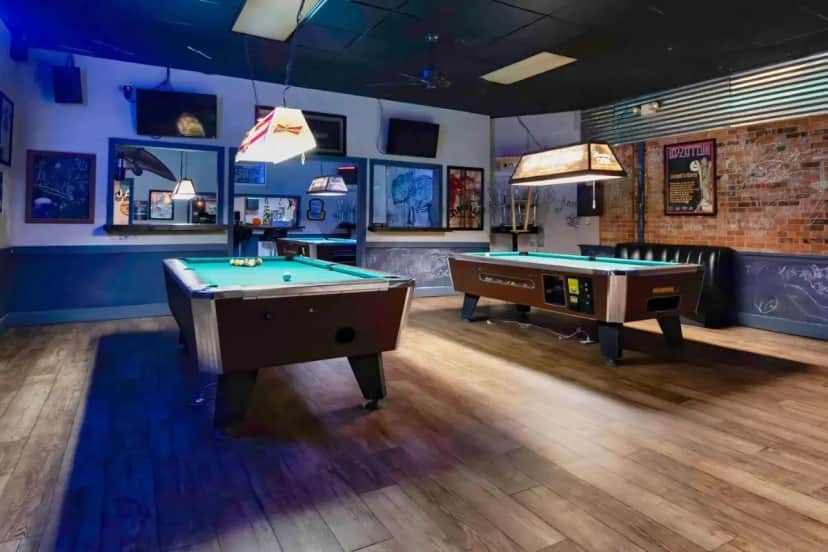 a billiard room with two pool tables in it at Studio 6 Jackson Mississippi I 55 in Jackson