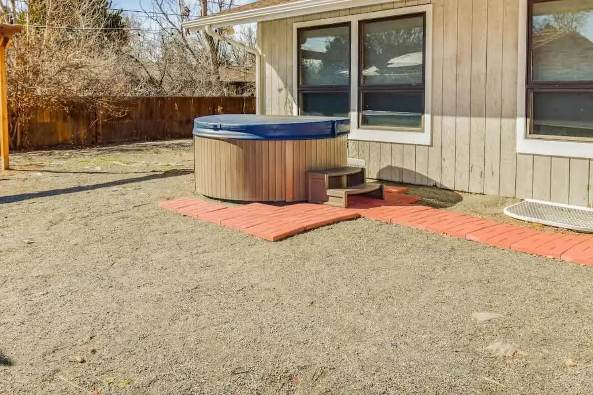 a trash can sitting outside of a house at Sunny Family Home in Denver with huge yard and hot tub in Denver