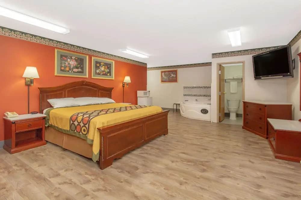 Private in-room jacuzzi tub in the Suite, 1 King Bed, Non Smoking (Luxury) at Super 8 by Wyndham Bedford