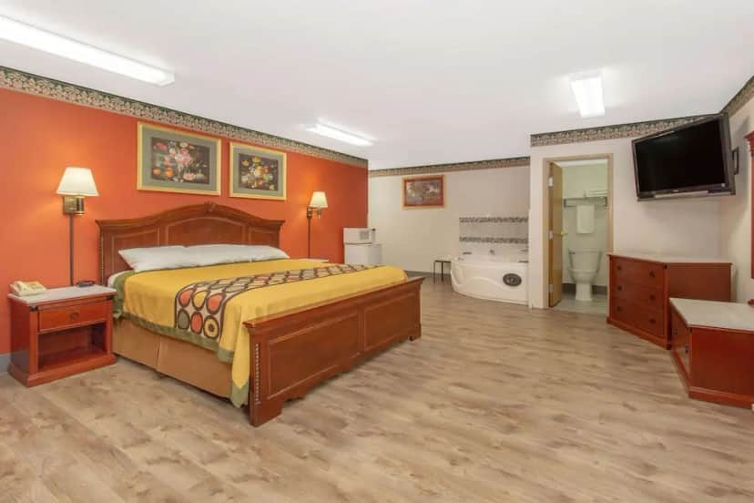 Private in-room jacuzzi tub in the Suite, 1 King Bed, Non Smoking (Luxury) at Super 8 by Wyndham Bedford