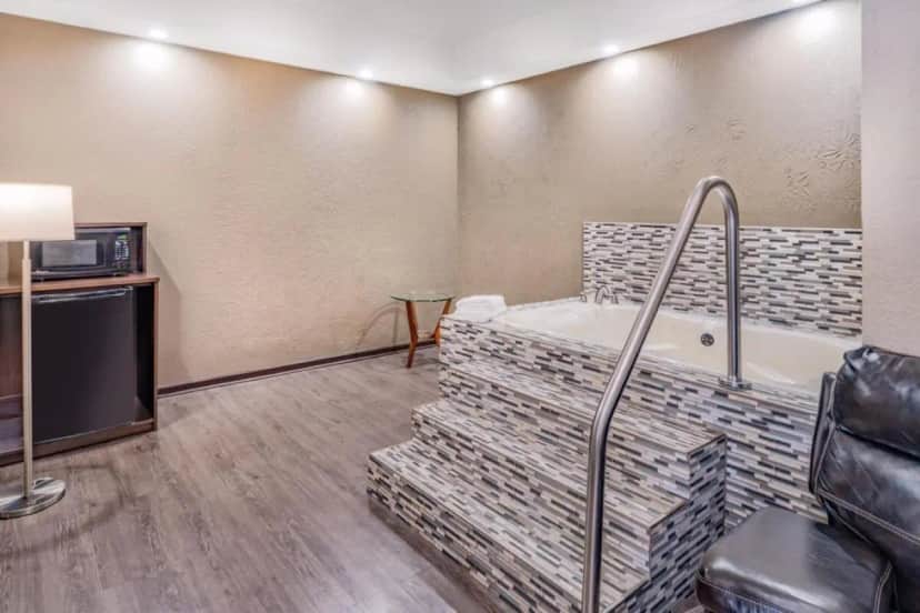 Private in-room jacuzzi tub in the Deluxe King Suite with Spa Bath - Non-Smoking at Super 8 by Wyndham Columbia