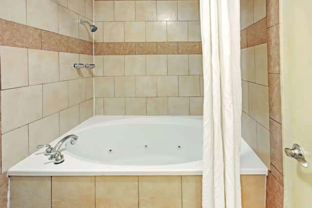 Jetted bathtub at Super 8 Dallas East Near Fair Park Downtown
