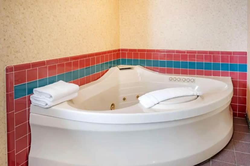 Private in-room jacuzzi tub in the King Room with Jetted Tub - Non-Smoking at SureStay Plus By Best Western Enterprise