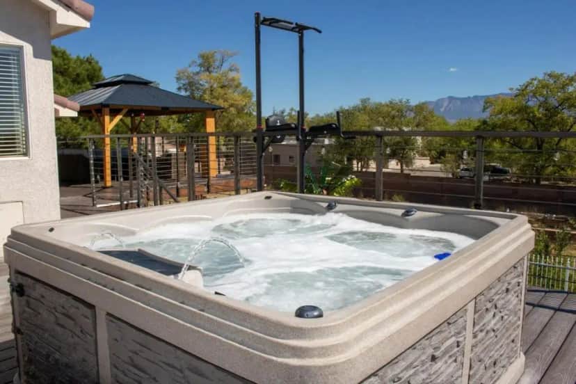 a hot tub on the deck of a house at Swimming Pool! Hot Tub, Ping-Pong & Pool Table in Albuquerque