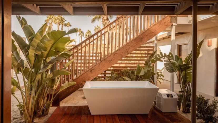a bathroom with a bath tub and a staircase at Terra Palm Springs in Palm Springs