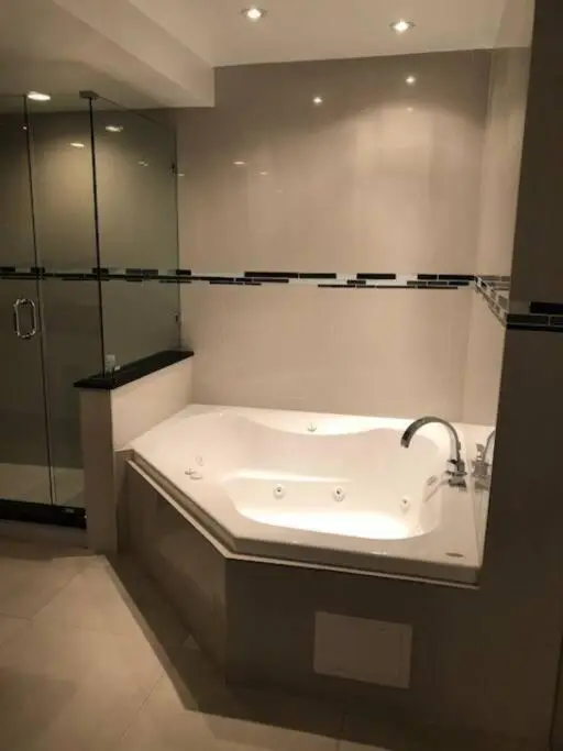 Private in-room jacuzzi tub in the Two-Bedroom Apartment at The Alexander