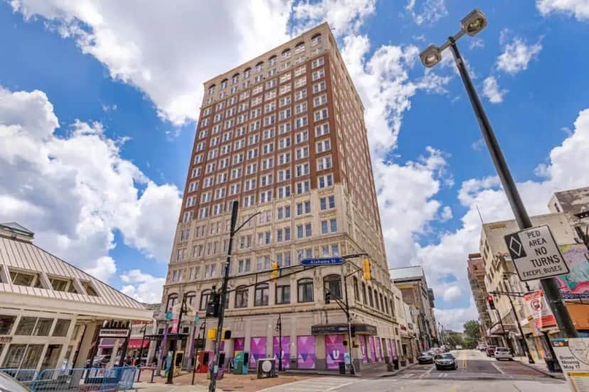 a tall building on the corner of a city street at The Connally Hotel Downtown Atlanta, an Ascend Collection Hotel in Atlanta