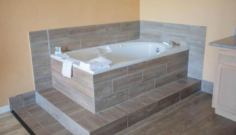 Private in-room jacuzzi tub in the King Suite with Whirlpool at The Crossroads Hotel & Suites