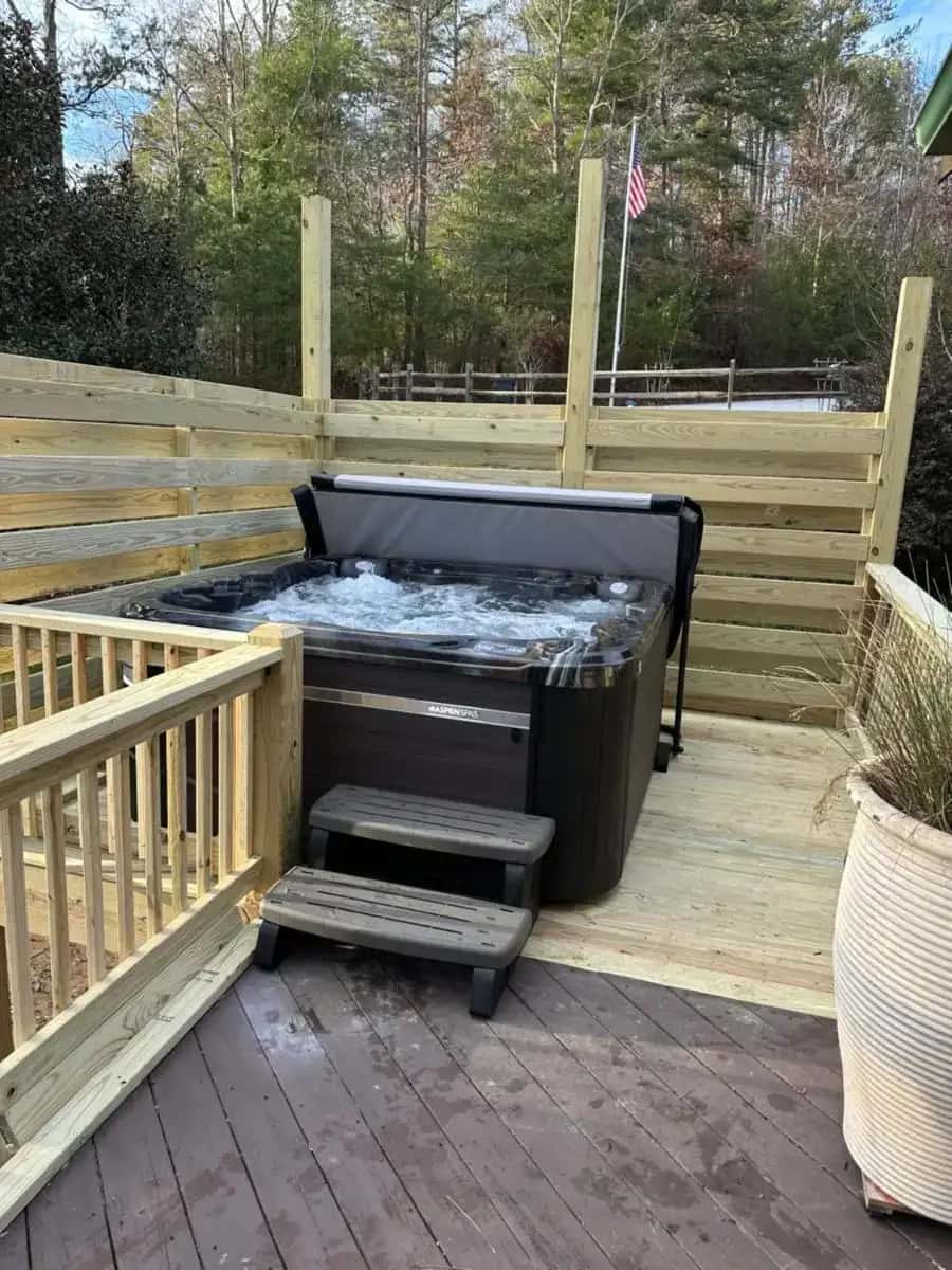 Private outdoor hot tub at The Dream Road Escape Cabin and Hot Tub in Chimney Rock, NC