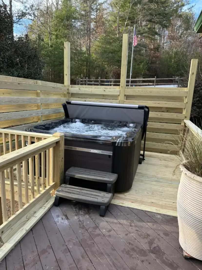 Private outdoor hot tub at The Dream Road Escape Cabin and Hot Tub in Chimney Rock, NC