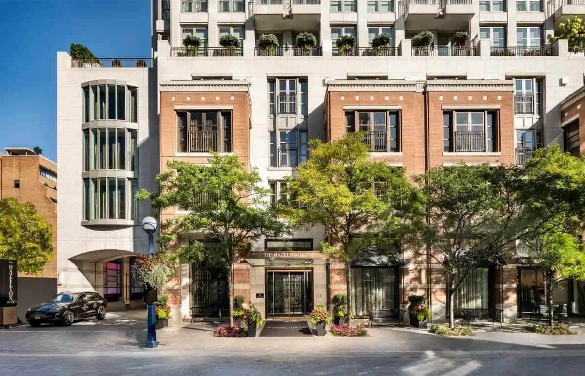an apartment building with trees in front of it at The Hazelton Hotel in Toronto