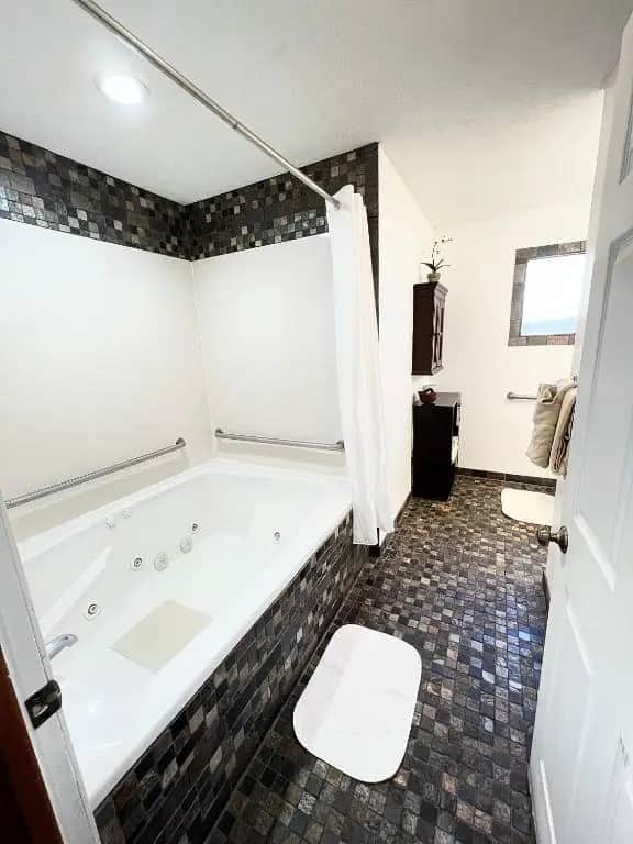 Private in-room jacuzzi tub in the Deluxe King Room with Fireplace at The Homestead Inn