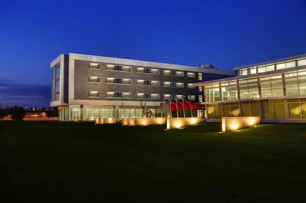 a large building with lights in front of it at THE HOTEL AT KIRKWOOD CENTER in Cedar Rapids