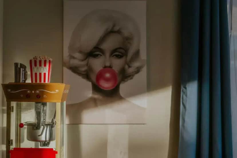 a painting of a woman with a red tongue at The Monroe H Pool, Sunken Firepit, Gym,Karaoke,EV in Indio