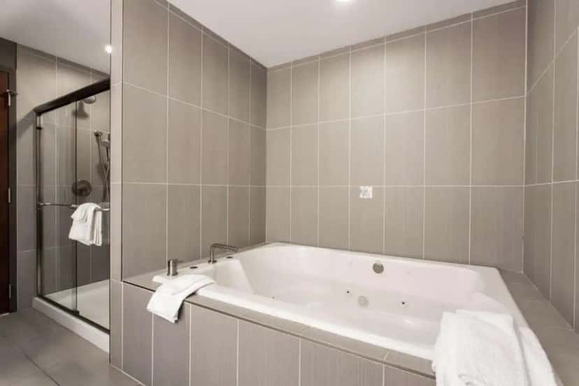 In-room jacuzzi tub at The Mosey Buffalo Williamsville Tapestry Collection Hilton in Williamsville, NY