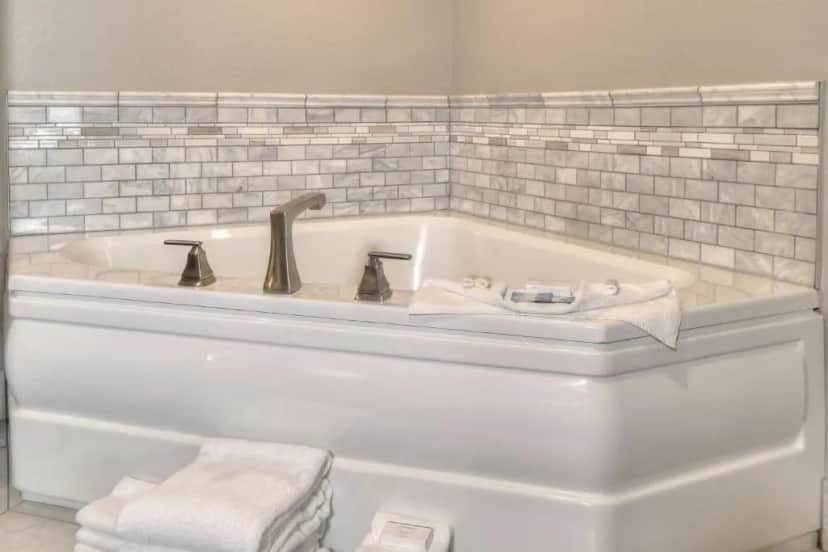 Private in-room jacuzzi tub in the King Room Mini-Suite with Jacuzzi & Fireplace at The Ramsey Hotel and Convention Center