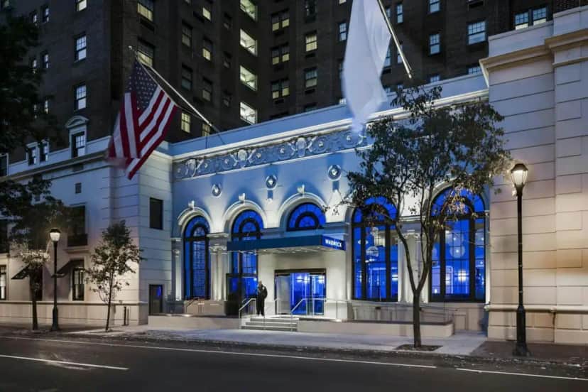 a building with an american flag in front of it at The Warwick Hotel Rittenhouse Square Philadelphia in Philadelphia