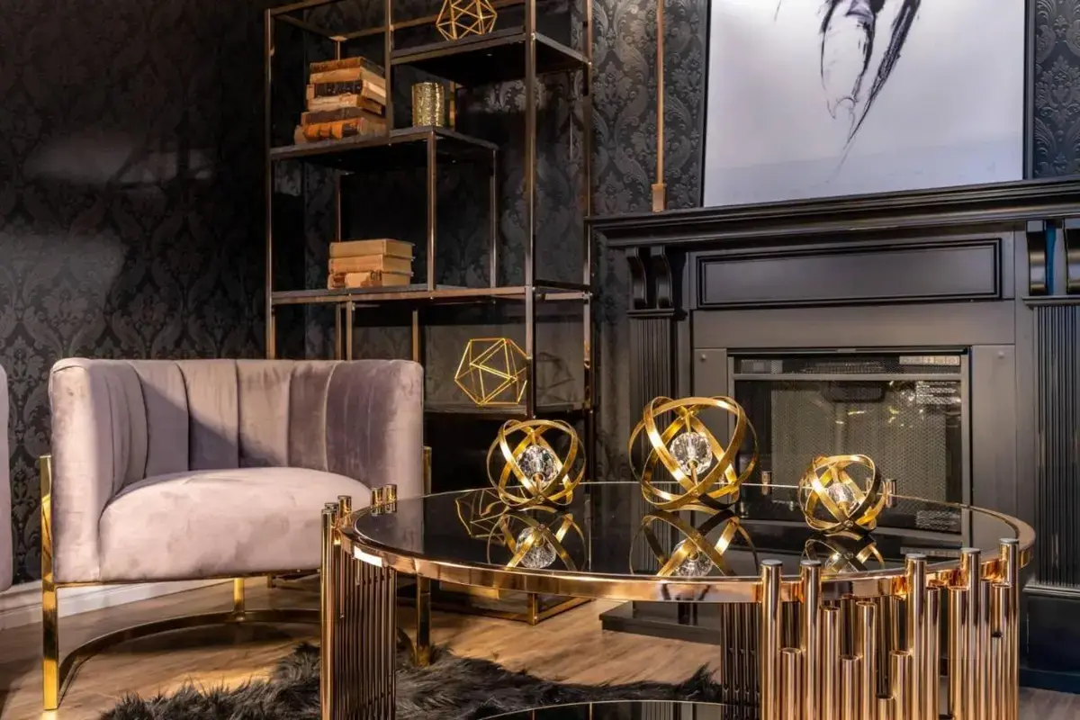 a living room with a coffee table and a fireplace at The Volare, an Ascend Collection Hotel in San Clemente