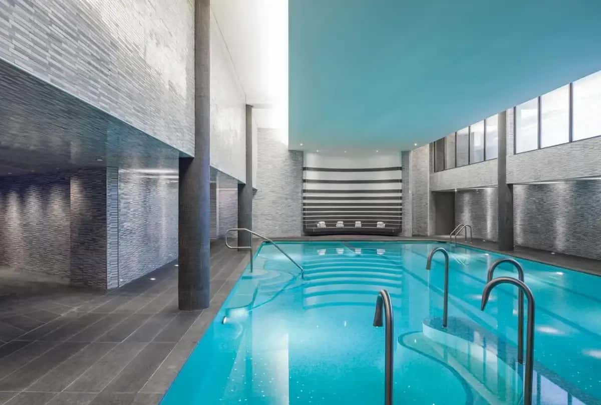a large swimming pool in a building at The Watergate Hotel Georgetown in Washington, D.C.