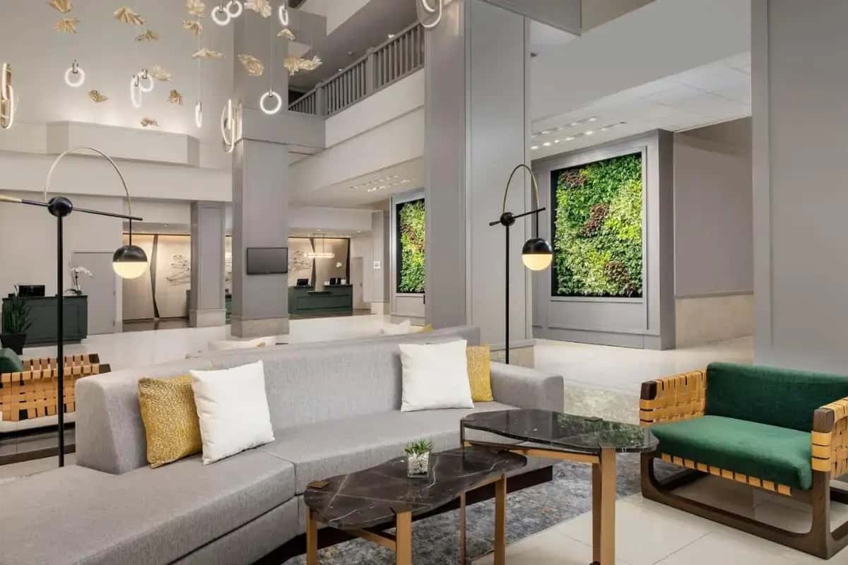 a living room with a couch and a table at The Westin Dallas Fort Worth Airport in Irving