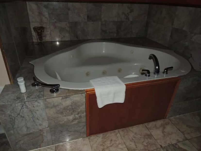 Private in-room jacuzzi tub in the Deluxe King Suite at The Whispering Pines Inn
