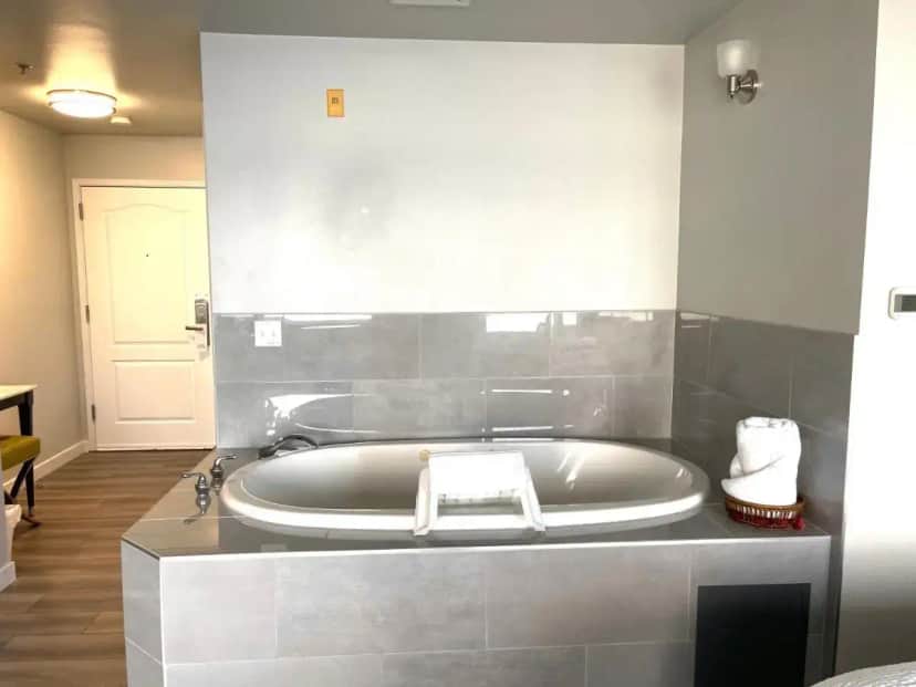 a large bath tub in a bathroom with a tub at Tides Inn & Suites in Port Townsend
