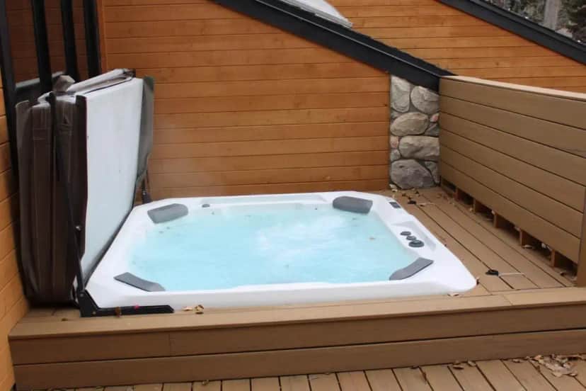 a jacuzzi tub on the deck of a house at Vail Valley Property in Montezuma